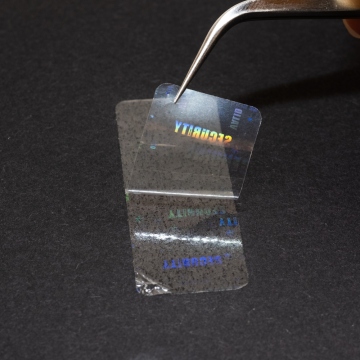 Film d'étanchéité transparent avec étiquettes holographiques cachées 45x17 mm